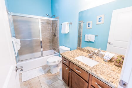 Bathroom 2 - Start or end your day by freshening up in this clean and functional bathroom with a spacious vanity and a shower/tub combination.