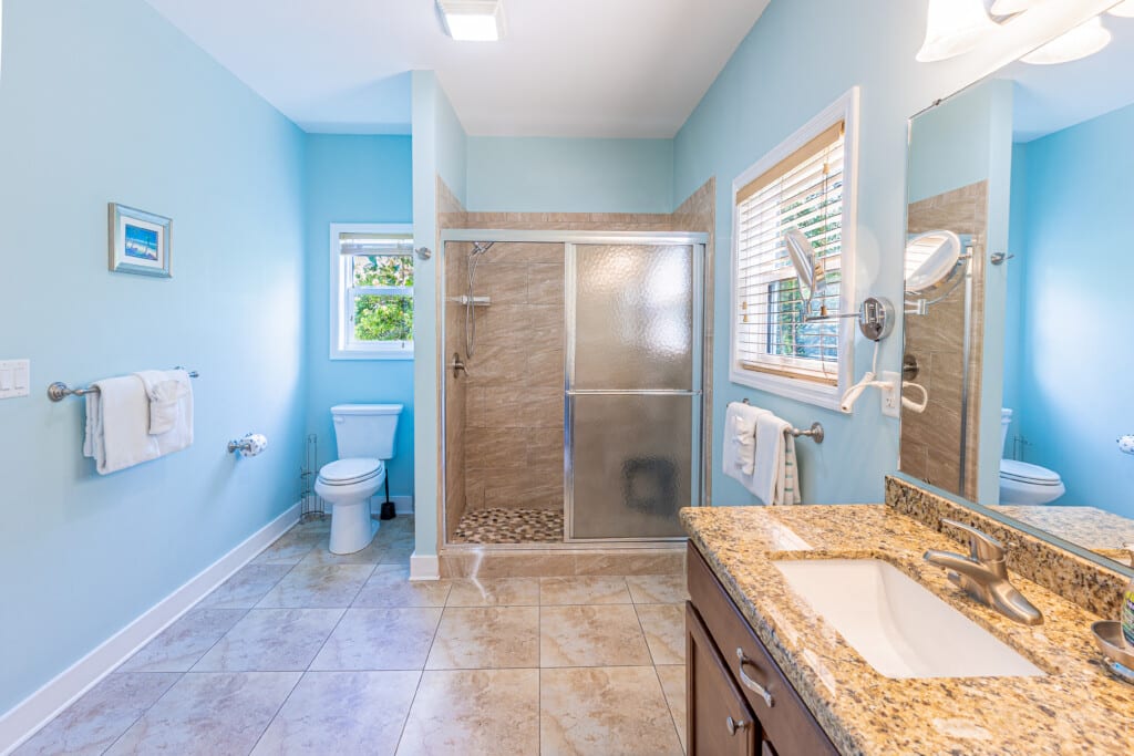 Bathroom 1 - Enjoy a private oasis with a large walk-in shower, double vanity, and spacious closet designed for comfort and convenience.