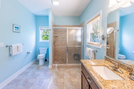 Bathroom 1 - Enjoy a private oasis with a large walk-in shower, double vanity, and spacious closet designed for comfort and convenience.