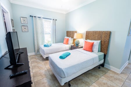 Bedroom 2 - Whether you're traveling with family or friends, this welcoming bedroom offers two comfortable Twin Beds, and your own Smart TV for unwinding after a day of adventure.