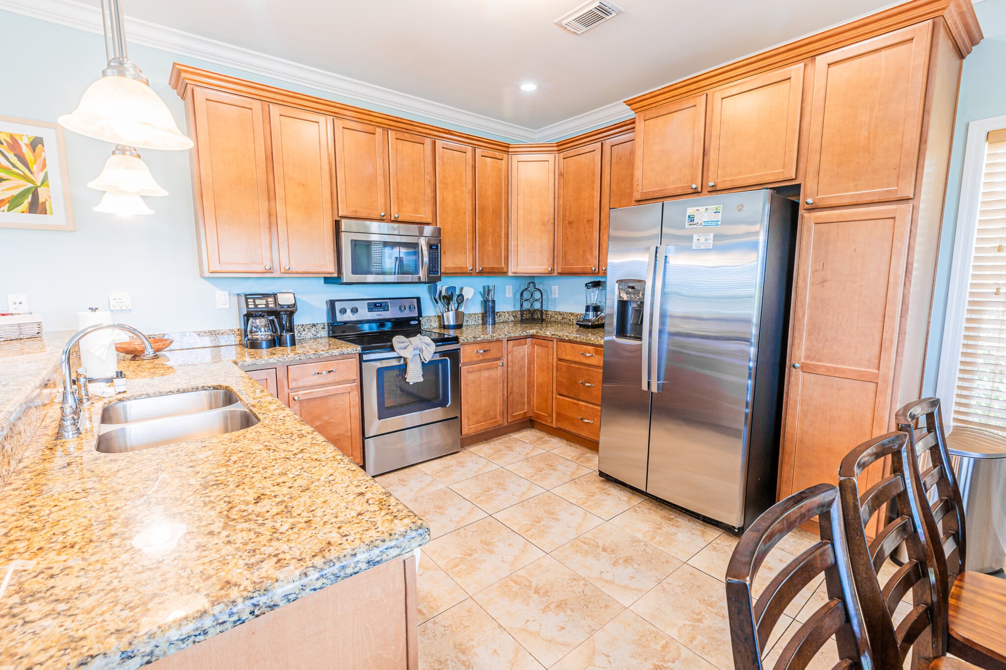Prepare your favorite meals in this spacious, fully stocked kitchen featuring the essentials for cooking, serving, and enjoying meals together.