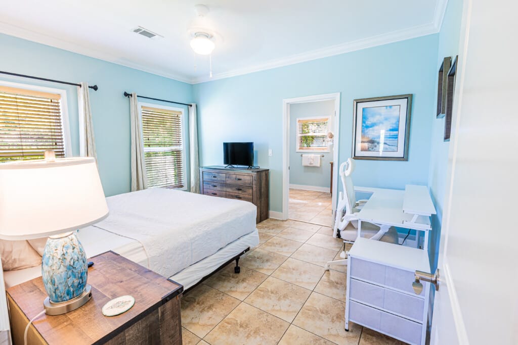 Primary Bedroom - Designed for comfort and convenience, this spacious bedroom offers a large closet, dedicated workstation, King Bed, TV, and private En-Suite Bathroom.