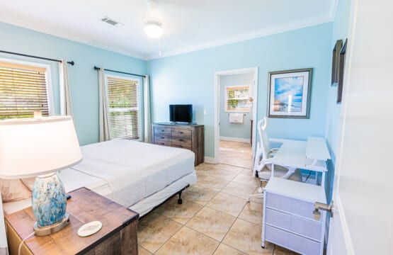 Primary Bedroom - Designed for comfort and convenience, this spacious bedroom offers a large closet, dedicated workstation, King Bed, TV, and private En-Suite Bathroom.
