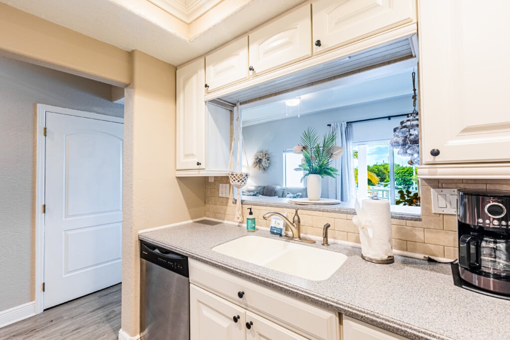 Enjoy a fresh, inviting kitchen with crisp white cabinets, beautiful finishes, and everything you need for your stay.