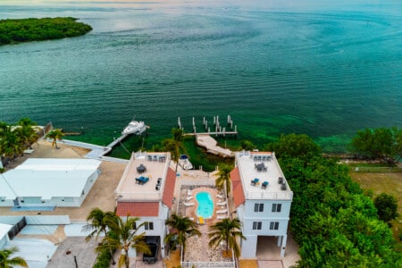 Surrounded by swaying palms and turquoise waters, this is island living at its best.