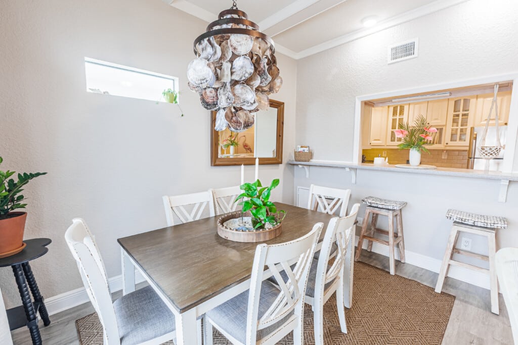 Charming dining area with stylish seating, a cozy atmosphere, and coastal-inspired details.