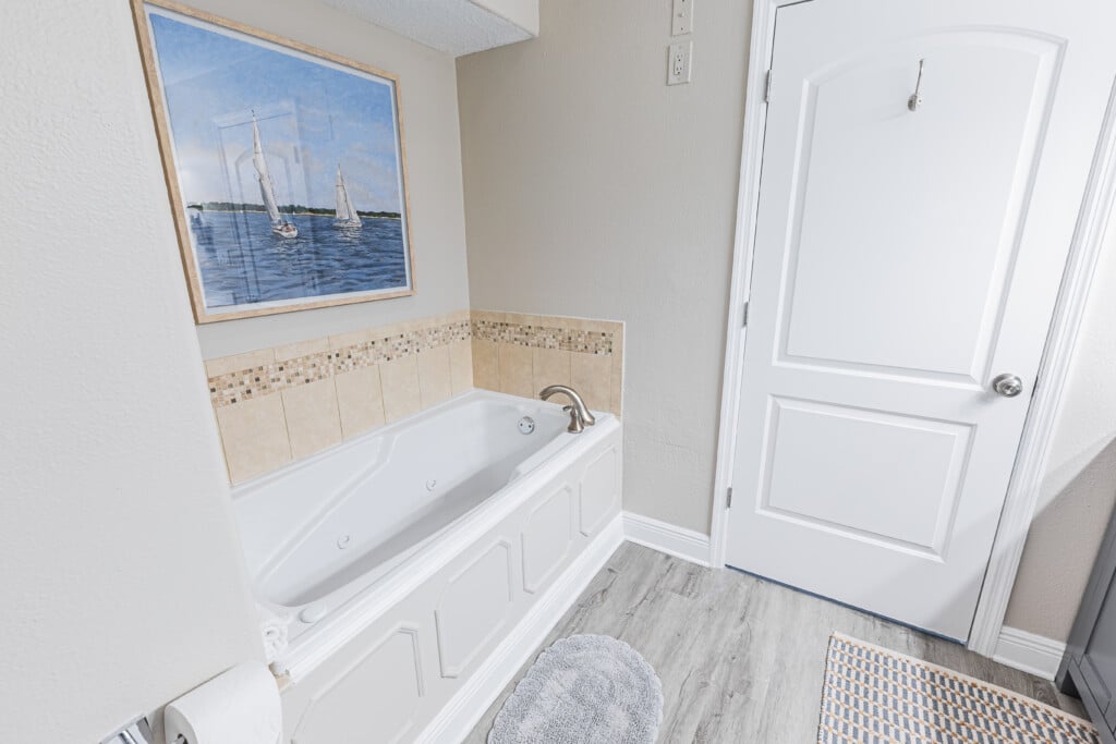 Bathroom 1 - Refresh and recharge in a spacious bathroom featuring a separate shower and tub, plus a double vanity for effortless mornings.