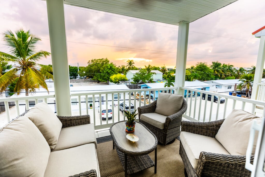 Enjoy a relaxing stay on your private balcony, with comfortable seating and beautiful tropical views